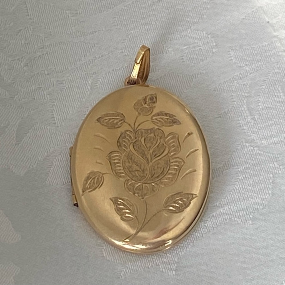 Vintage gold locket etched with flower design
